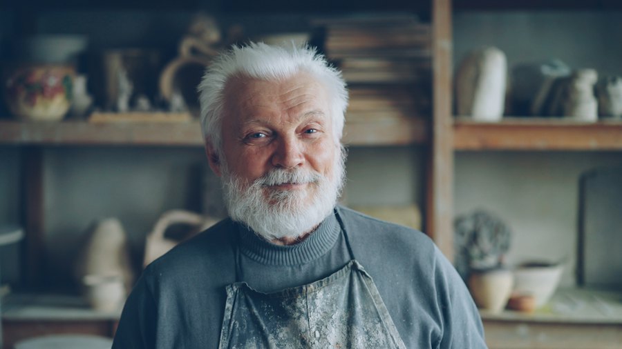 A proud craftsman standing in his workshop