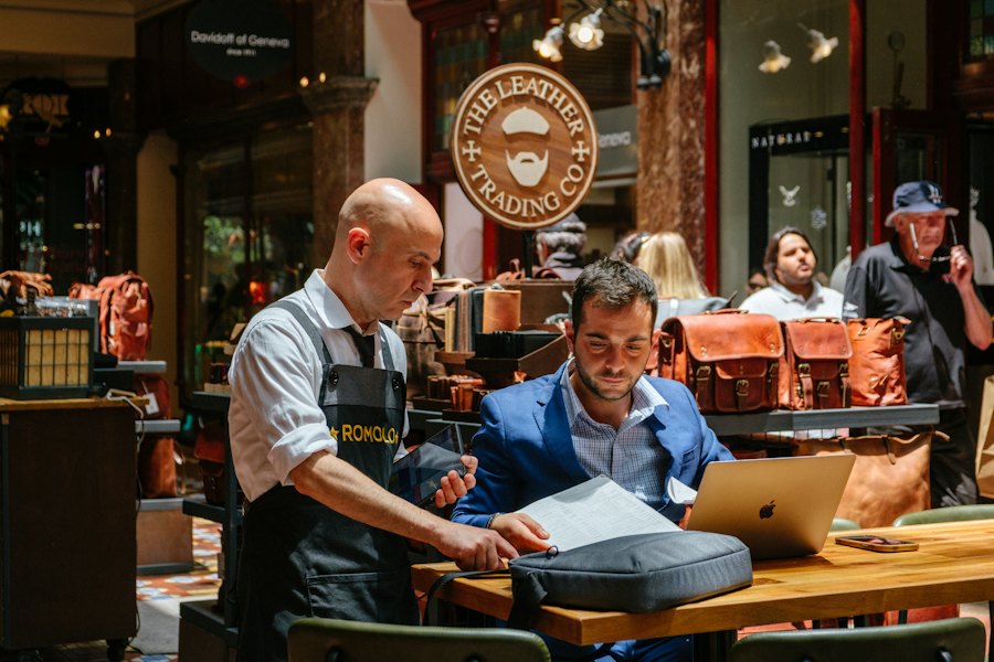 An owner and an advisor working side by side in his store